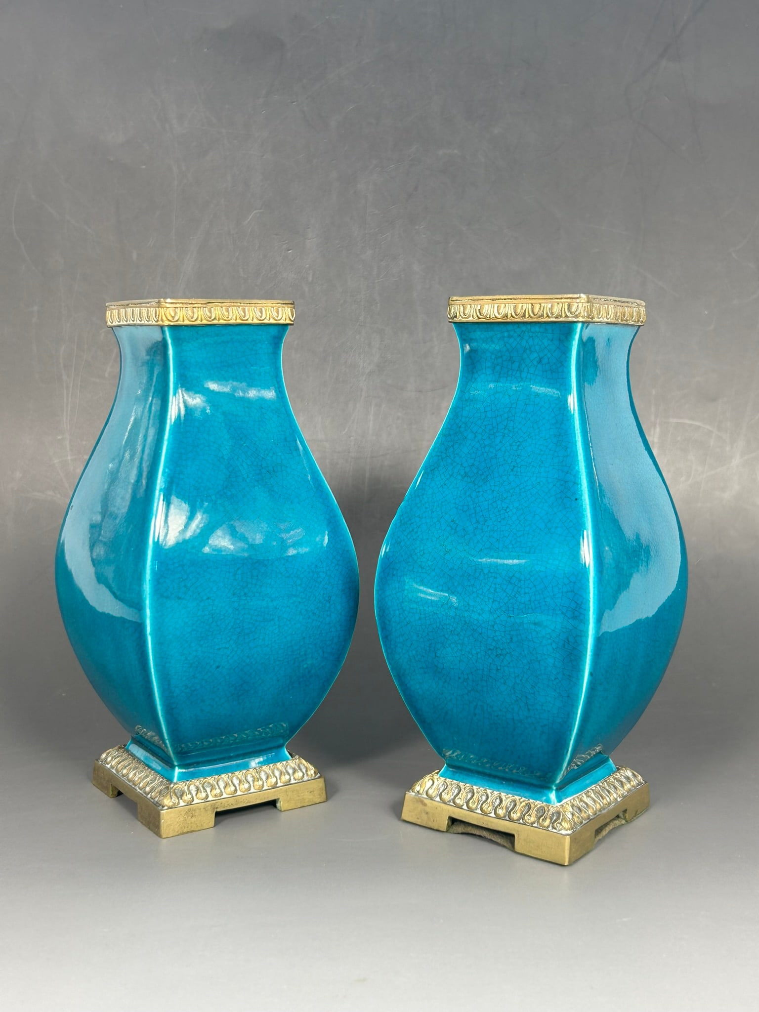 A Pair of Gilt-Bronze Mounted Turquoise-Glazed Vases, Fanghu: 6.3/4 in. high, 3.1/8 in. wide overall each.