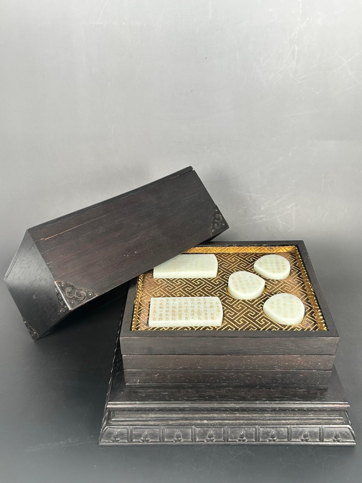 A Group of Twenty Chinese White Jade Plaques with a Wood Box and Cover (1 of 14)