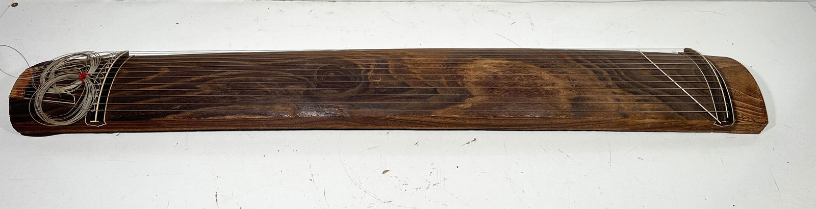 A Japanese Music Instrument, Koto: 73 in. long, 10 in. wide.