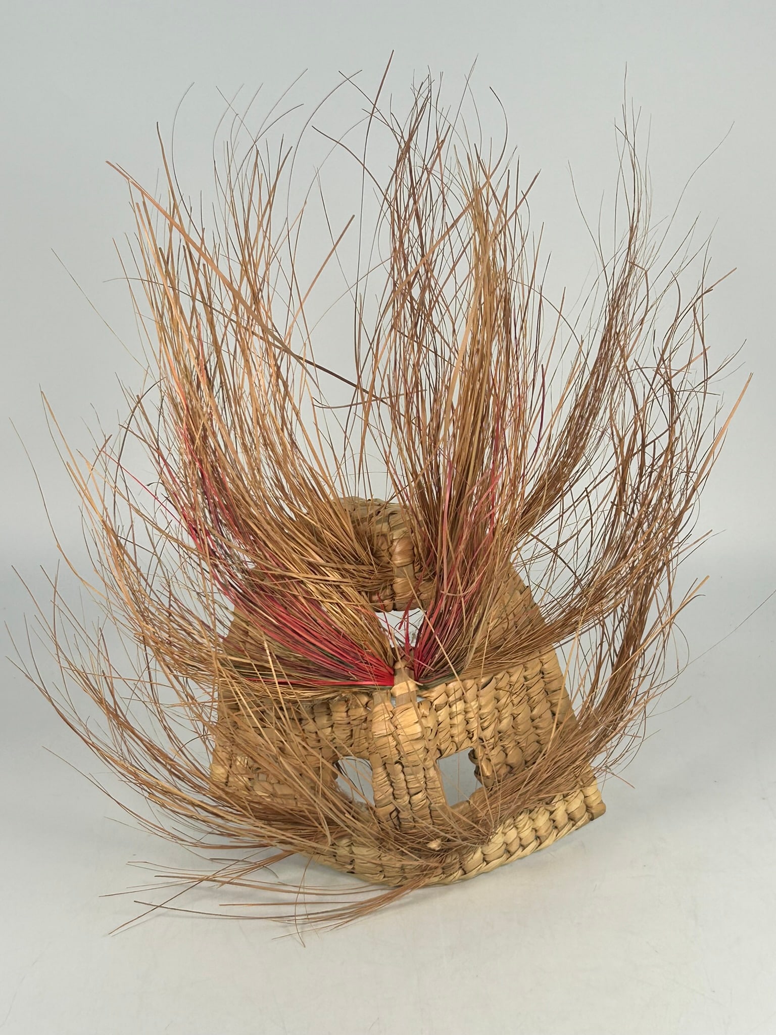 A Mexican Handwoven Tiliche Mask: 15 in. high, 13.1/2 in. wide.