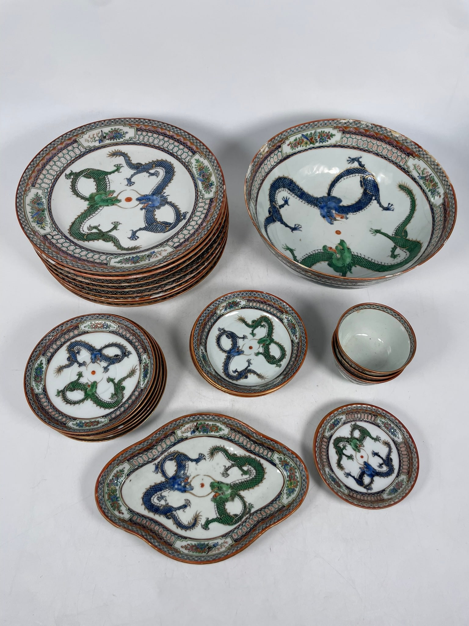 A Group of Twenty-Five Chinese Famille Rose Porcelain 'Double-Dragon' Service (Part) (1 of 19)