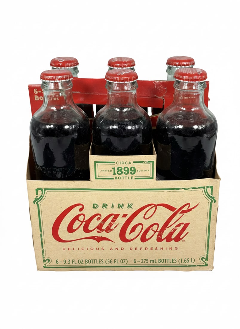A Set of Circa 1899 Limited Edition 2007 Holiday Coca-Cola Six-Pack of Bottles: 7.3/4 in. high, 7 in. wide.
