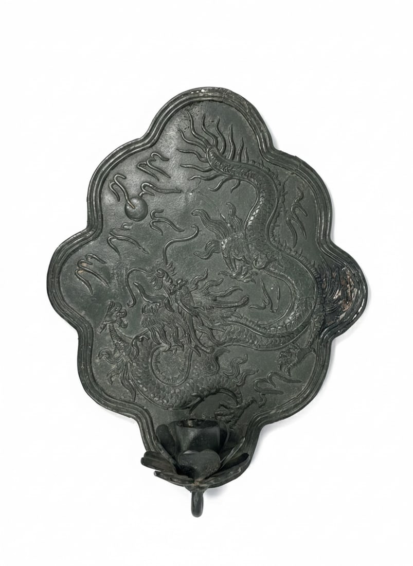 A Chinese Bronze 'Dragon' Wall Candle Sconce: 16.1/4 in. high, 12.1/2 in. wide.