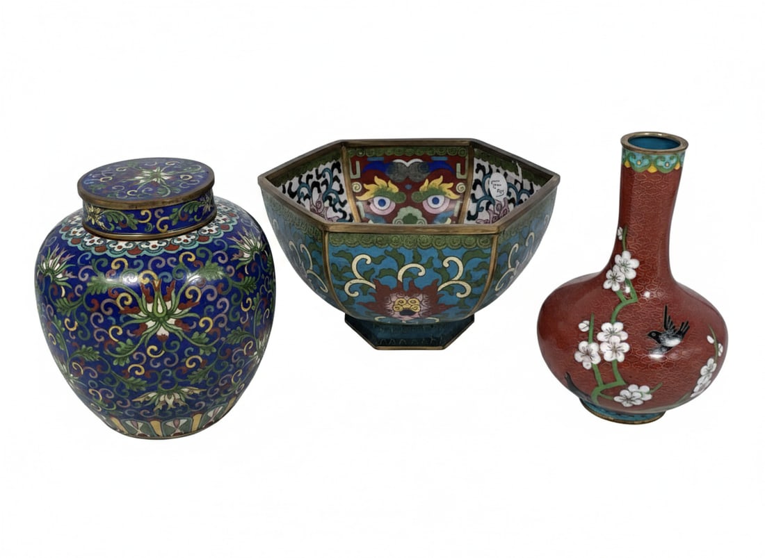 A Group of Three Chinese Cloisonne Enamel Ware: Comprising a hexagonal bowl, 4.1/8 in. high, 7.1/2 in. wide; a jarlet and cover, 5.1/2 in. high, 5 in. wide; and a small vase, 6.1/8 in. high, 4 in. wide.