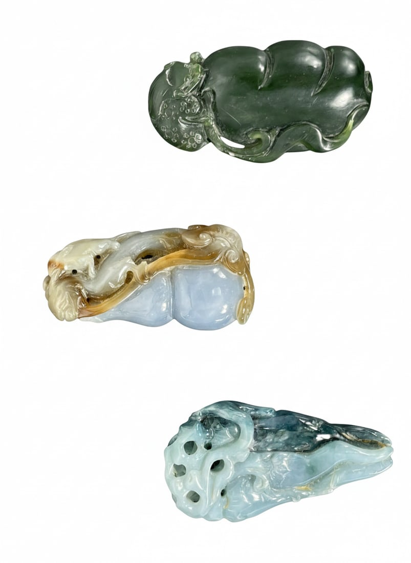 A Group of Three Chinese Carved Jadeite Pendants (1 of 19)