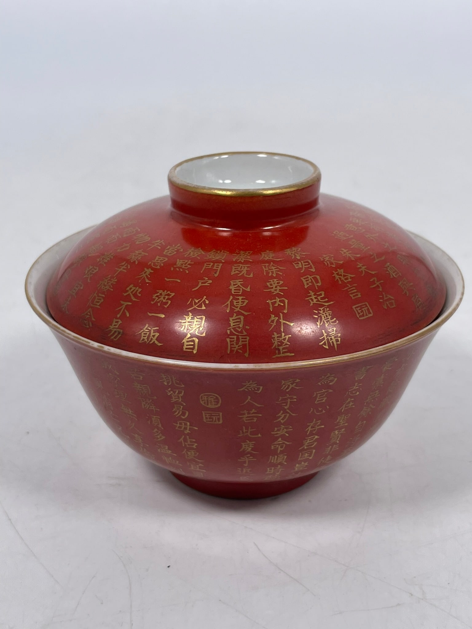 A Chinese Coral-Red-Glazed Gilt-Inscribed and Decorated Tea Bowl and Cover, Republic Period (1 of 7)