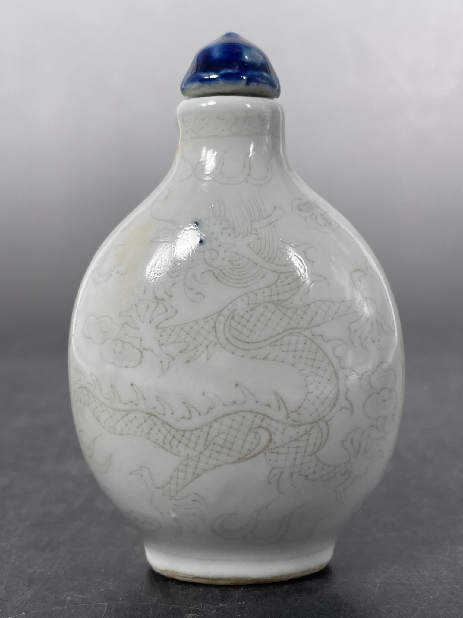 A Chinese Underglaze-Blue and Copper Red Porcelain 'Dragon' Snuff Bottle (1 of 10)