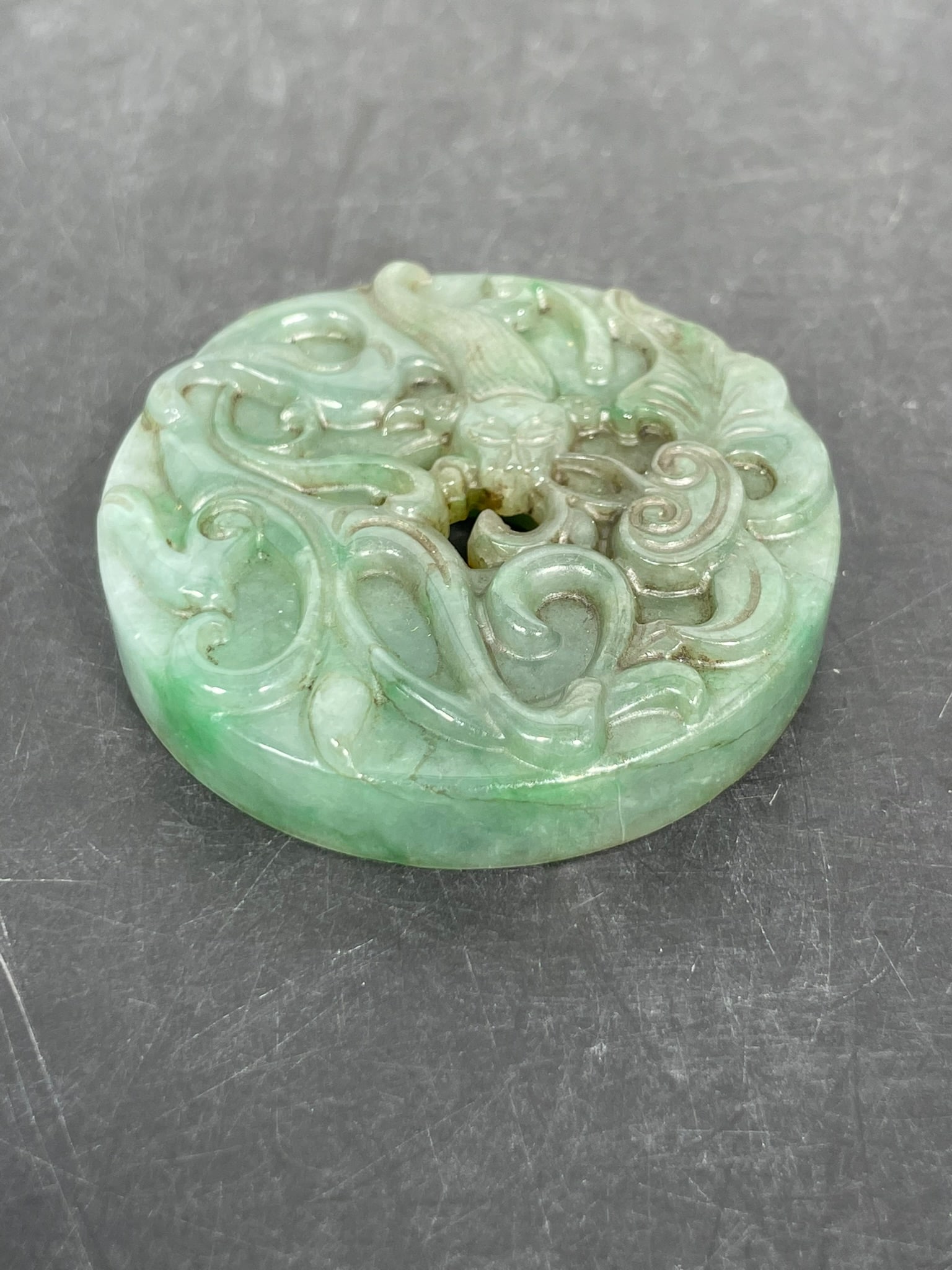 A Chinese Carved Jadeite Pendant, Bi (1 of 14)