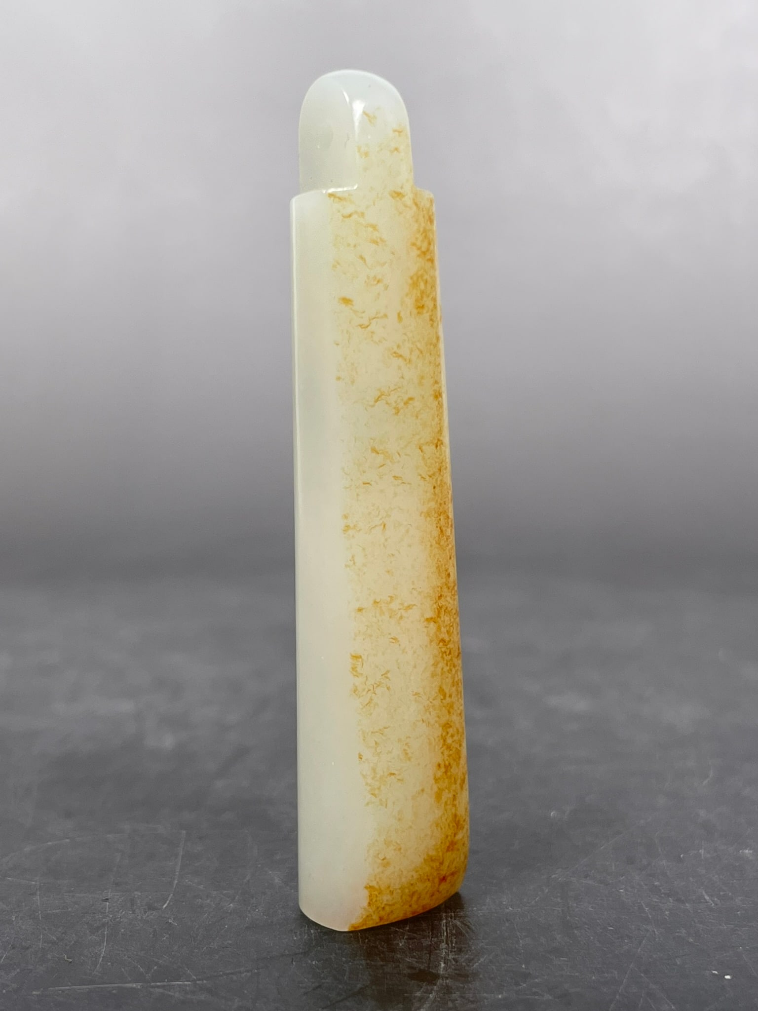 A Chinese White and Russet Jade Plume Holder (1 of 10)