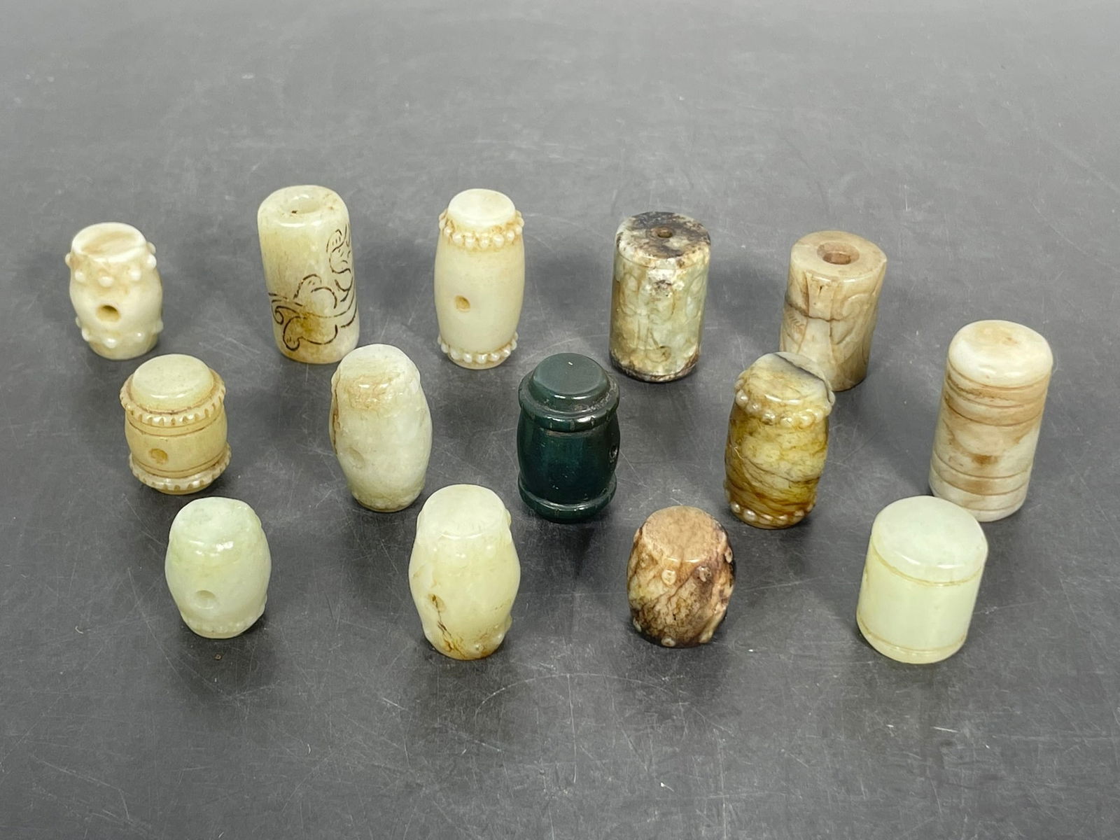 A Group of Fourteen Chinese Archaistic Jade Beads (1 of 16)