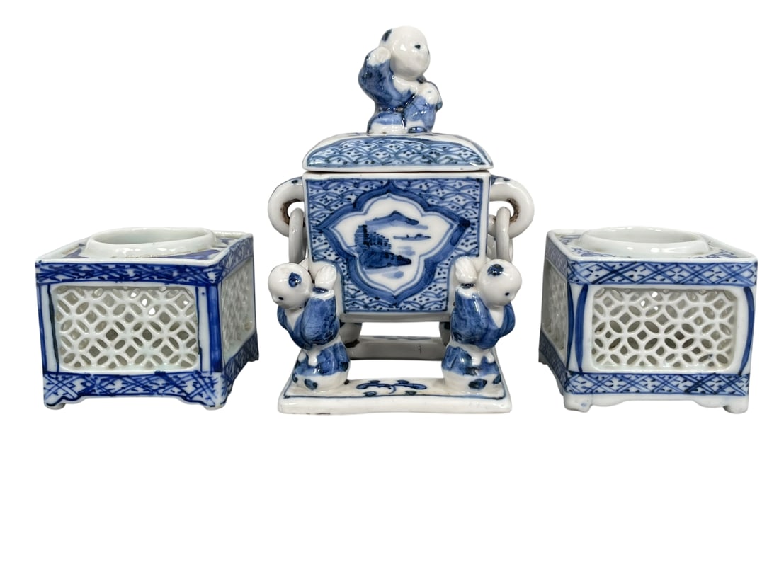 A Group of Three Japanese Blue and White Porcelain Koro: Comprising a 'boys' censer and cover, 5.1/4 in. high, 3.3/4 in. wide; and two reticulated square censers, 2.3/8 in. high, 2.5/8 in. square each.