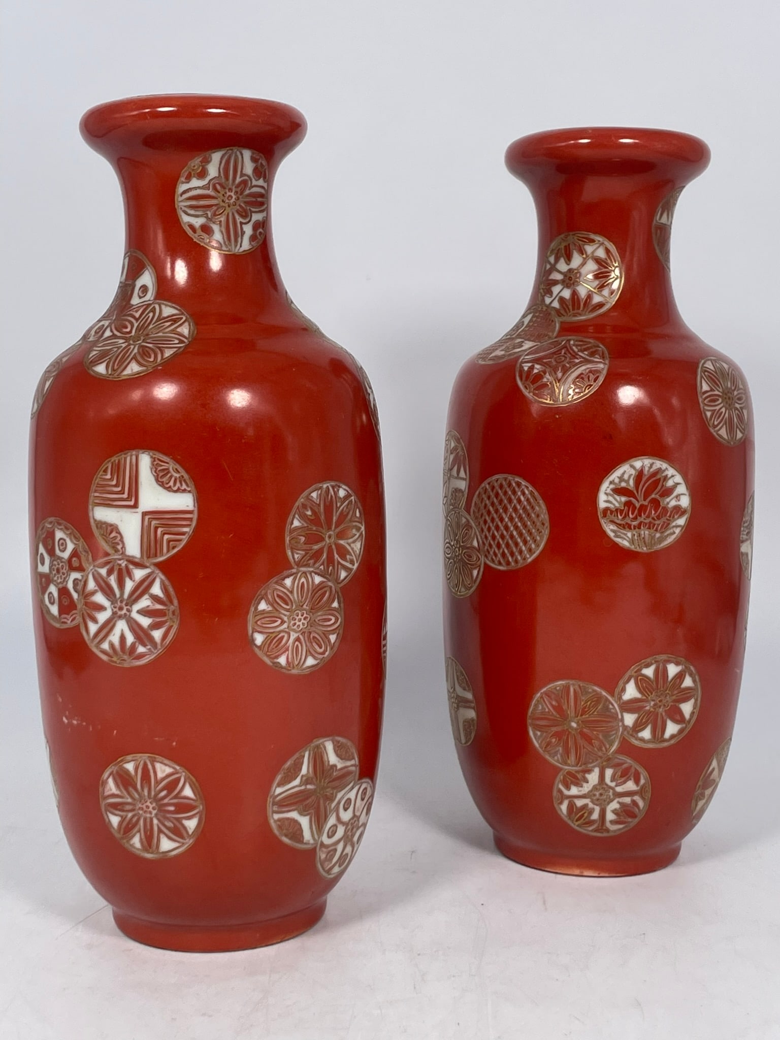 A Pair of Chinese Famille Rose Coral-Red-Ground Dish-Mouthed Vase: 10.1/4 in. high, 4.1/4 in. wide each.