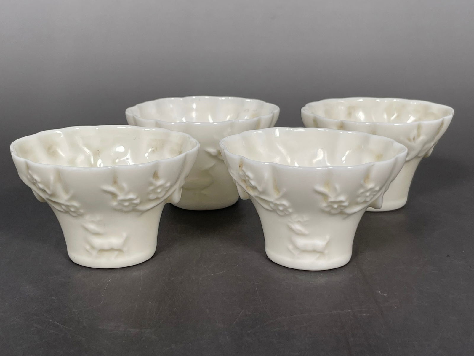 A Set of Four Dehua Cups: 1.3/4 in. high, 2.3/4 in. wide each.