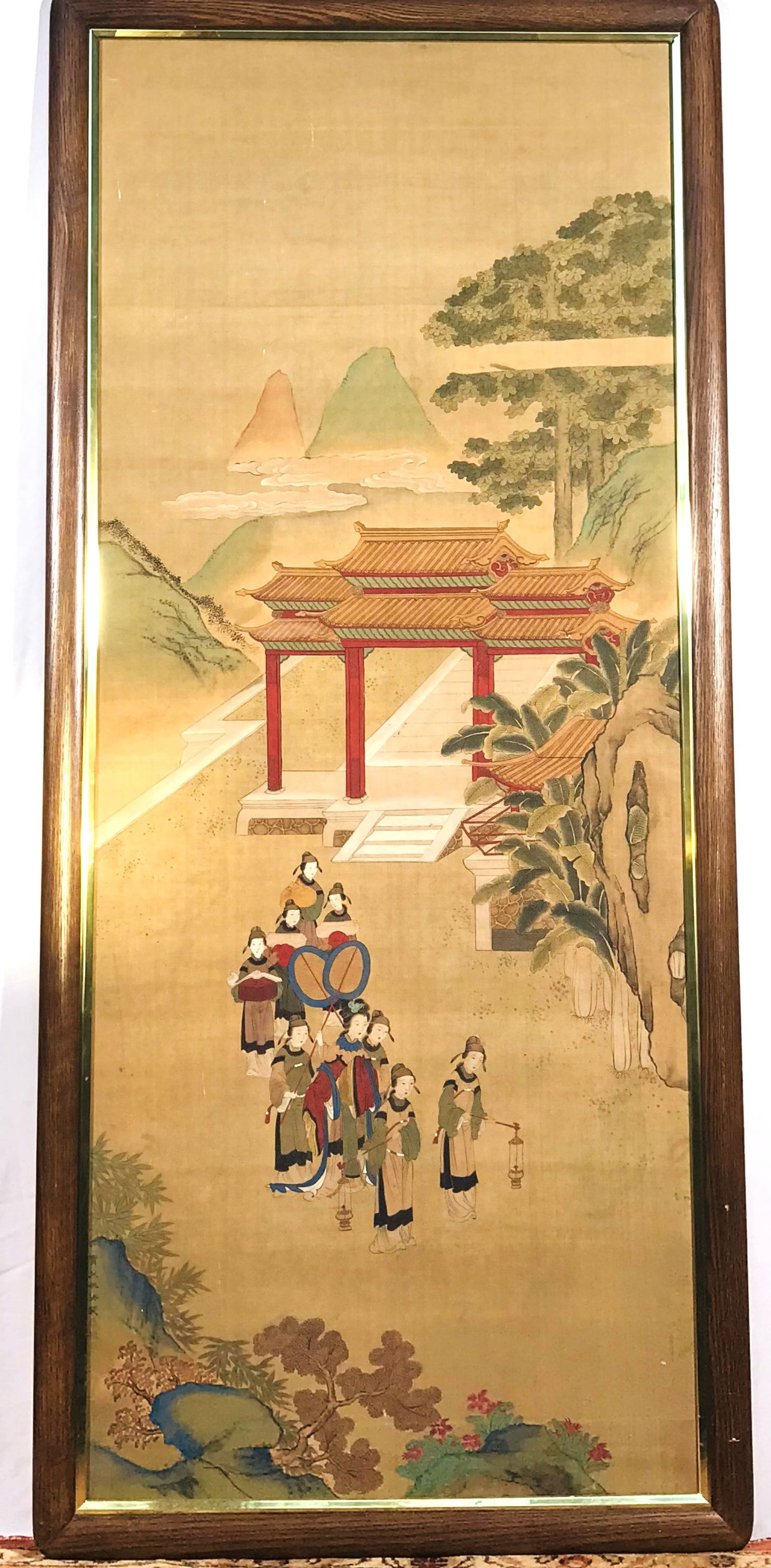 A Chinese Painting of Court Ladies Travelling, after Qiu Ying: Ink and color on silk, after Qiu Ying with a signature. 54.1/2 in. x 22 in. (sight), 58.1/2 in. x 22 in. (frame).