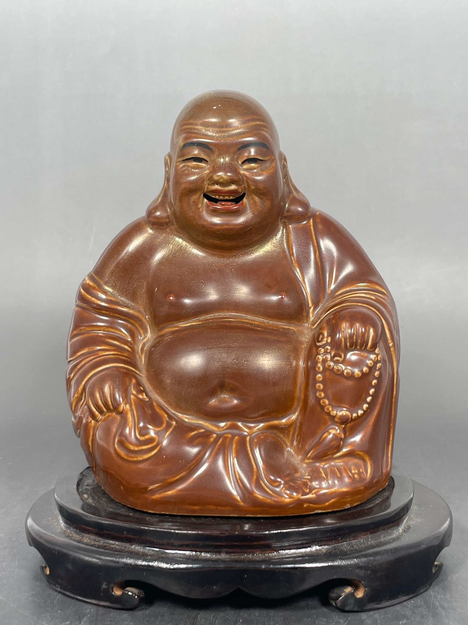 A Chinese Porcelain Figure of Budai (1 of 7)