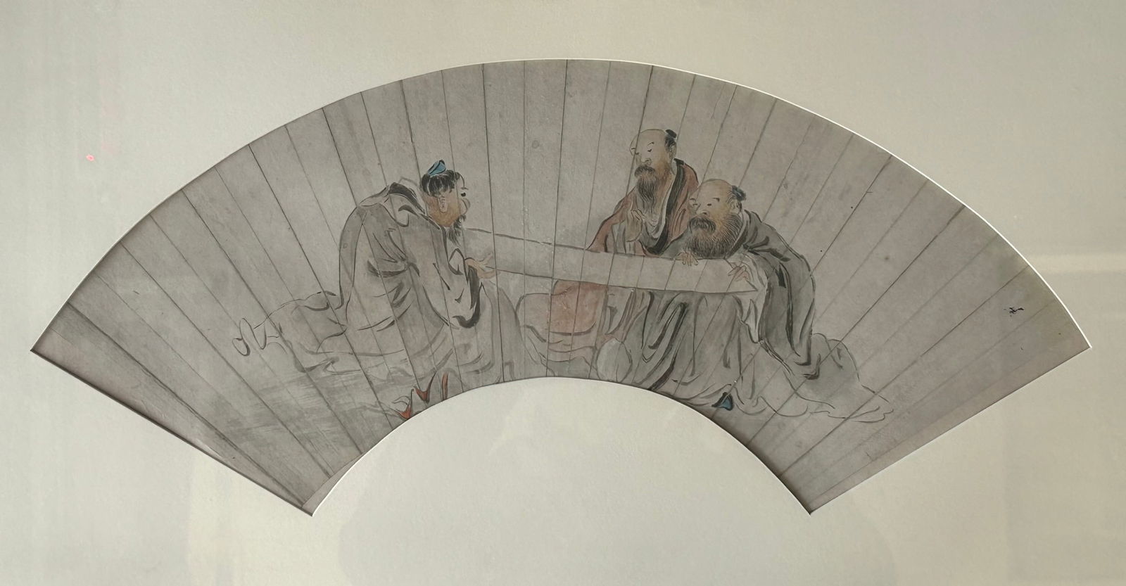 A Chinese Fan Leaf Depicting Scholars: Ink and color on paper, 19.1/2 in. long, 8.1/4 in. wide for the fan leaf, 25.1/4 in. x 15.1/4 in. for the frame.