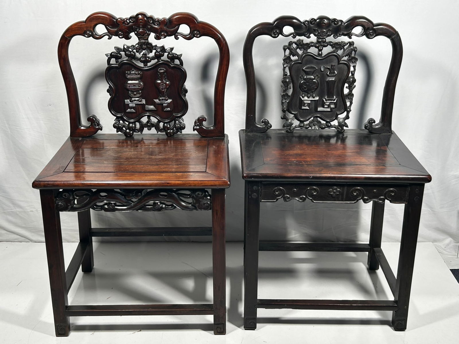 Two Chinese Hongmu Armchairs: 35 in. high, 20.1/2 in. wide, 16.1/2 in. deep each.