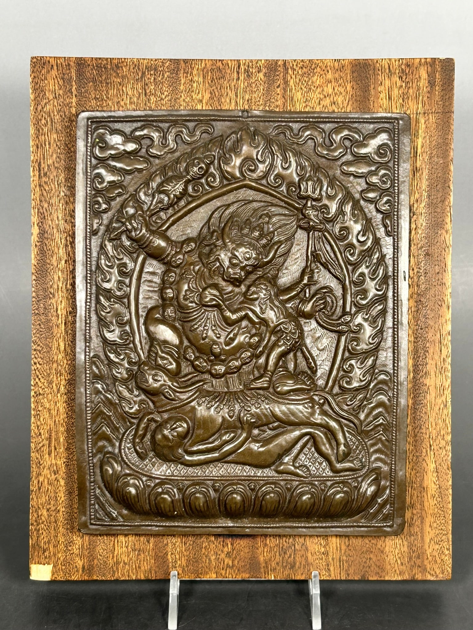 An Antique Tibetan 'Vajrabhairava' Bronze Plaque: Attached to a wood board, the plaque measures 7.1/2 in. x 6 in.
