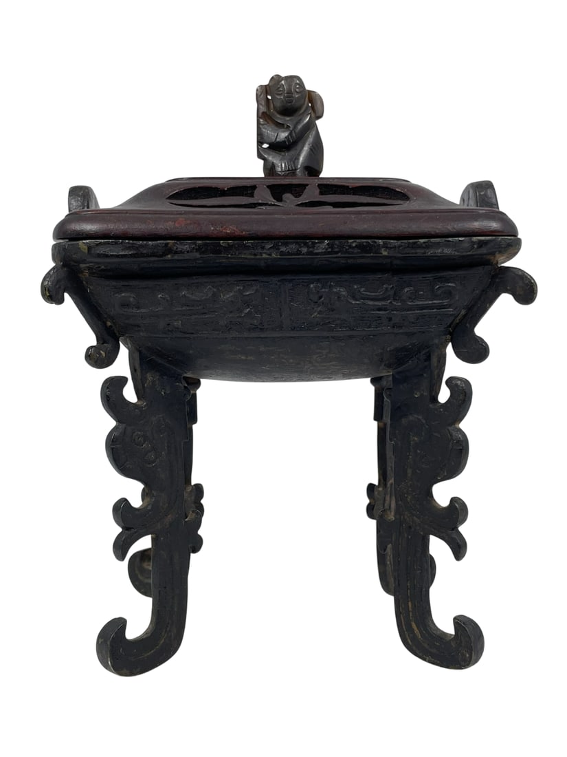 A Chinese Bronze Censer and Cover: 8 in. high, 5.3/4 in. wide.