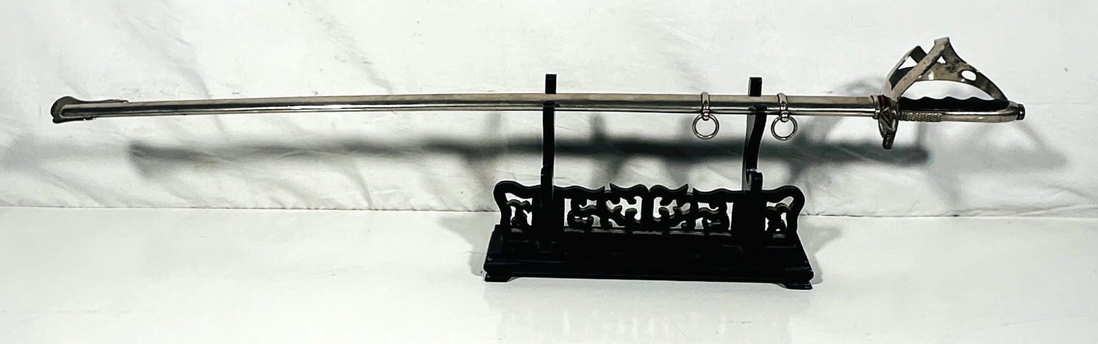 An Italian Straight Light Cavalry Sword, G. Gilardoni, Milano, Possibly 19th Century: Italian light cavalry straight sword by G. Gilardoni of Milan, complete with its sheath. The double-etched blade features exquisite floral and military motifs, and the ricasso is stamped 'G.