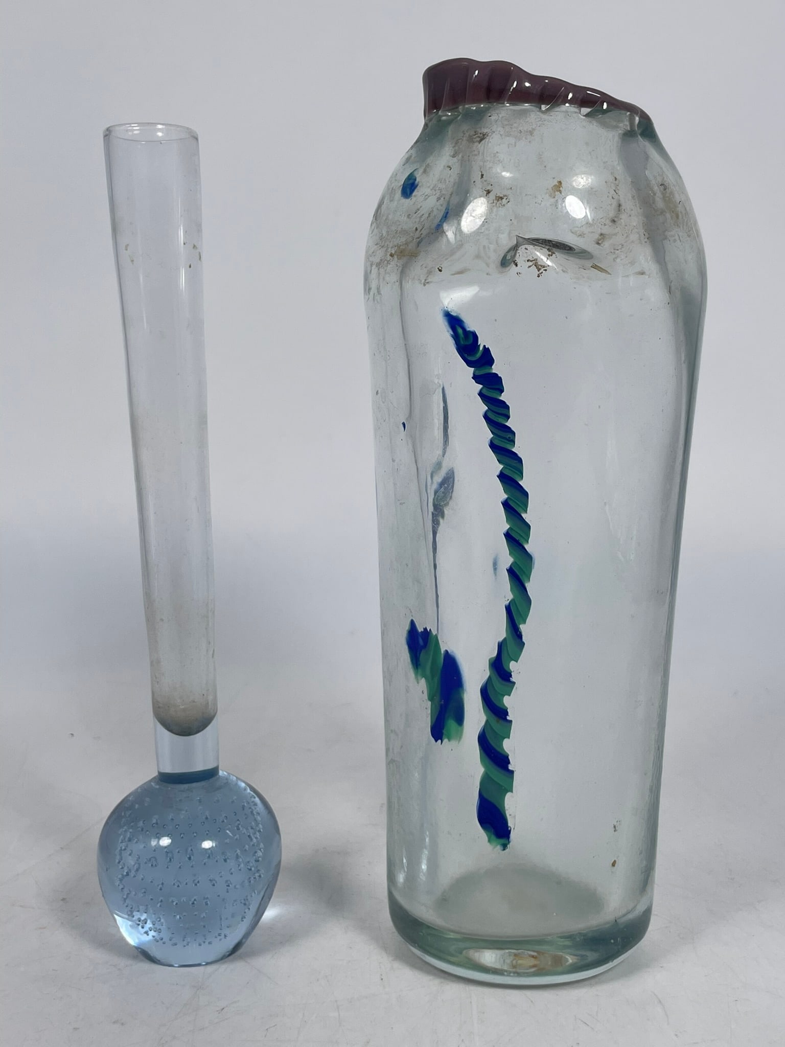 Two Art Clear Glass Vases: Comprising a bubble slim neck glass flower vase, 7.7/8 in. high, 1.3/4 in. wide; and another art glass vase, 8.1/4 in. high, 3.1/8 in. wide.