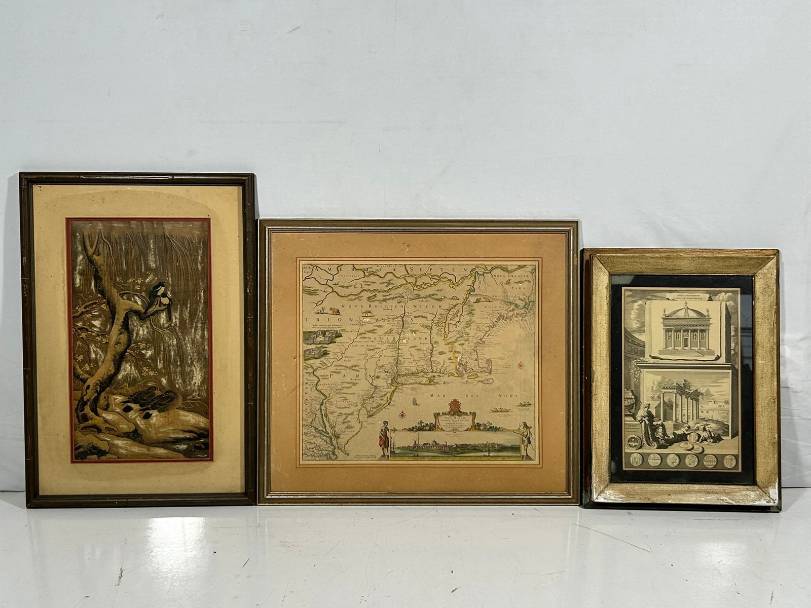 A Group of Three Reproduction Prints: Comprising a reproduction print of old map of New Netherland, New England and part of Virginia, originally created by Visscher in 1690, 23 in. x 21 in. overall including the frame; a reproduction