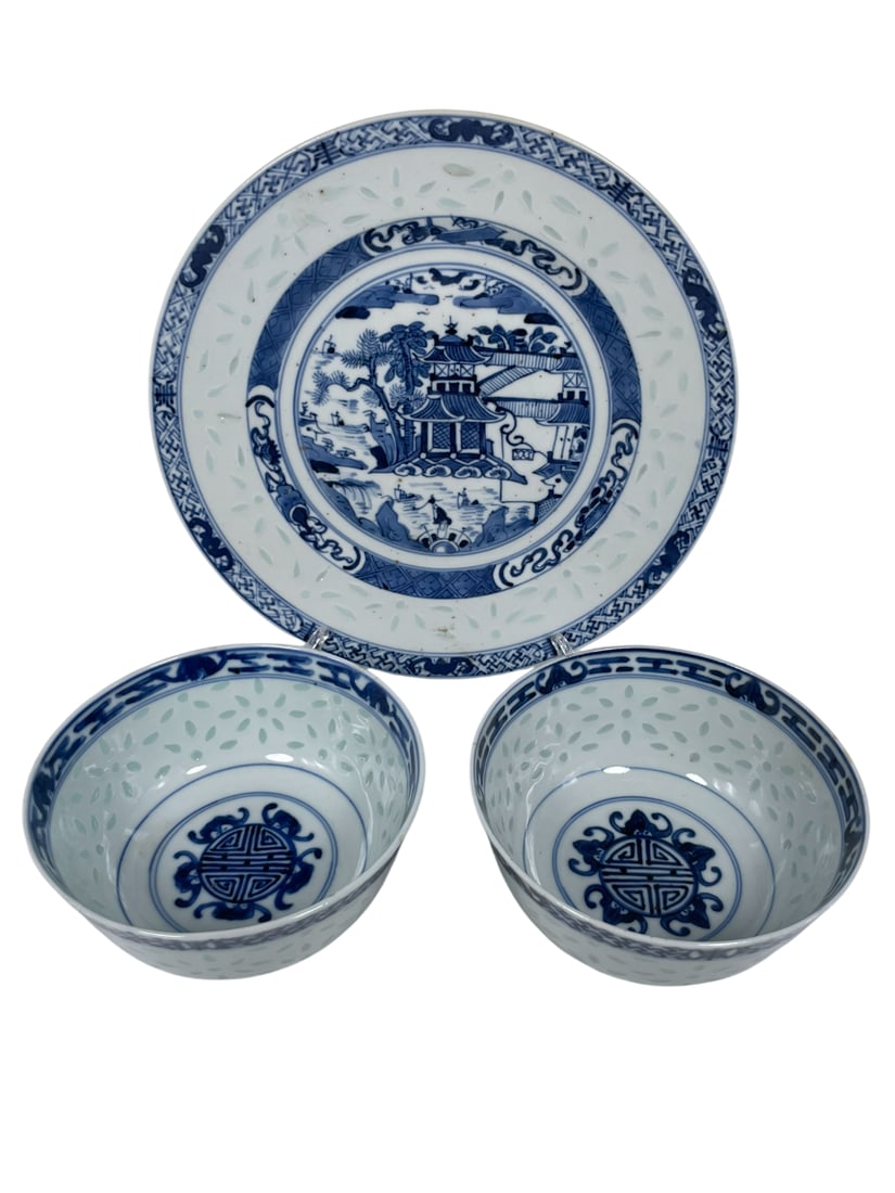 A Group of Three Chinese Blue and White 'Rice Pattern' Ware: Comprising a 'rivertown' dish, 8.1/2 in. diam.; and a pair of 'shou character' bowls, 2.5/8 in. high, 5 in. diam. each.