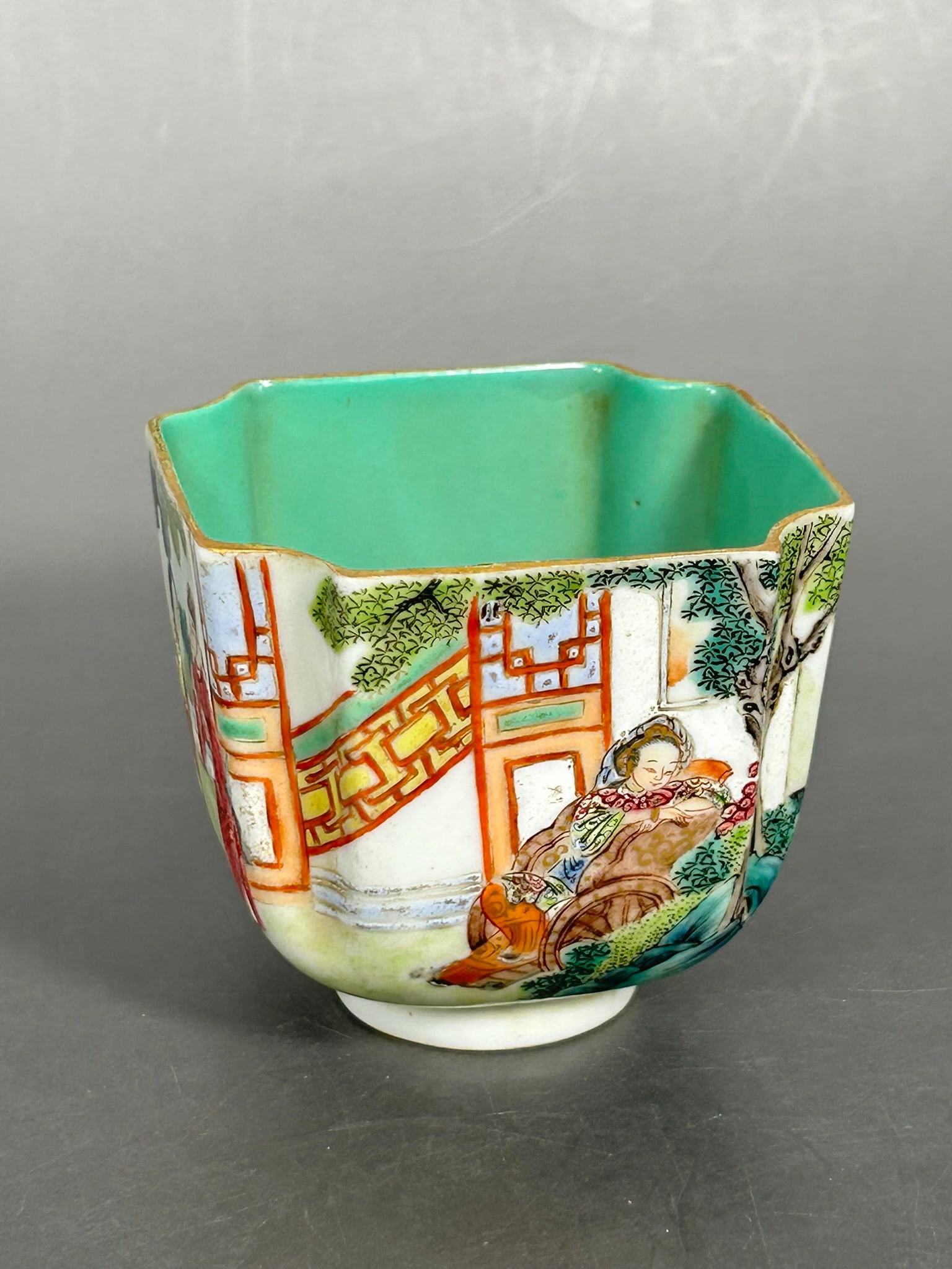 A Chinese Famille Rose Gilt-Decorated 'Figural' Cup, Daoguang Mark: 2.3/4 in. high, 3 in. square.