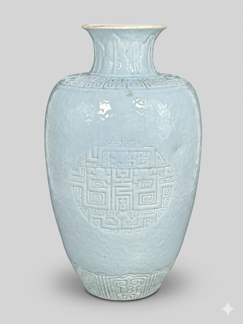 A Chinese Incised Celadon-Glazed Vase: 11.1/4 in. high, 6 in. wide.