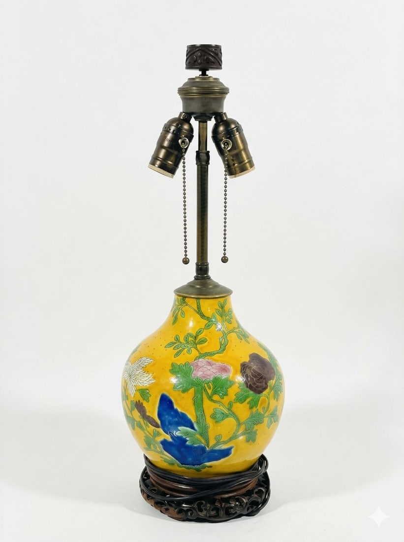 A Chinese Famille Rose Yellow-Ground Vase: Mounted as a lamp. 20.5 in. high, 7.25 in. wide.