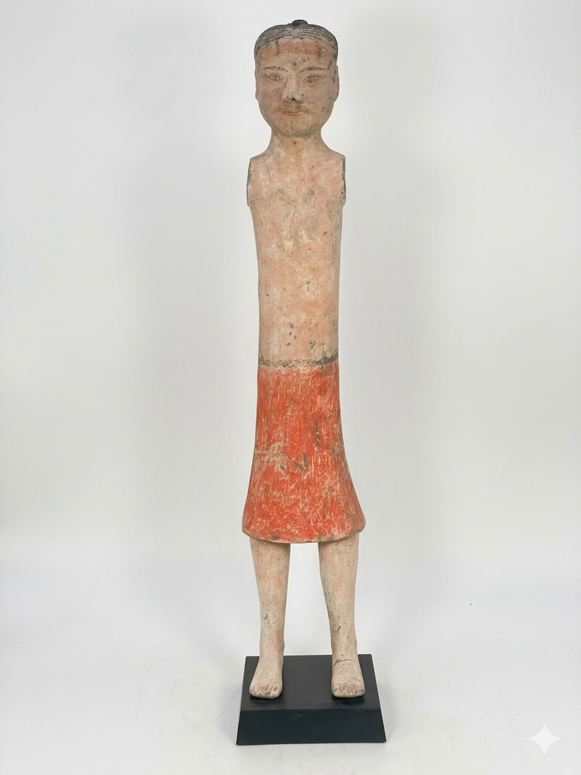 A Chinese Painted Pottery Figure of a Gentleman, Han Dynasty: With a stand. The figure measures 24.1/2 in. high, 4.3/4 in. wide.