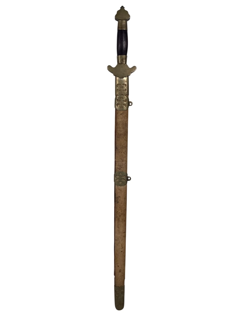 A Chinese Double-Sided Sword: 28 in. long for the cutting edge; 38.1/2 in. long overall.
