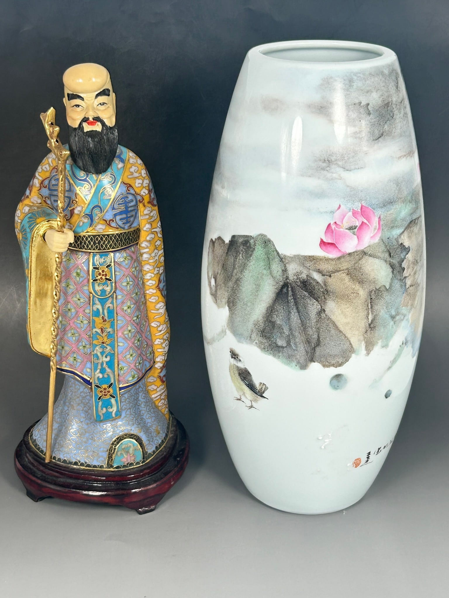 Two Chinese Porcelain Objects: Comprising a painted vase, 13.1/4 in. high, 6 in. wide; and a cloisonne and porcelain figure of Tieguai Li, mounted on a wood base, 13 in. high, 5.1/4 in. wide overall.