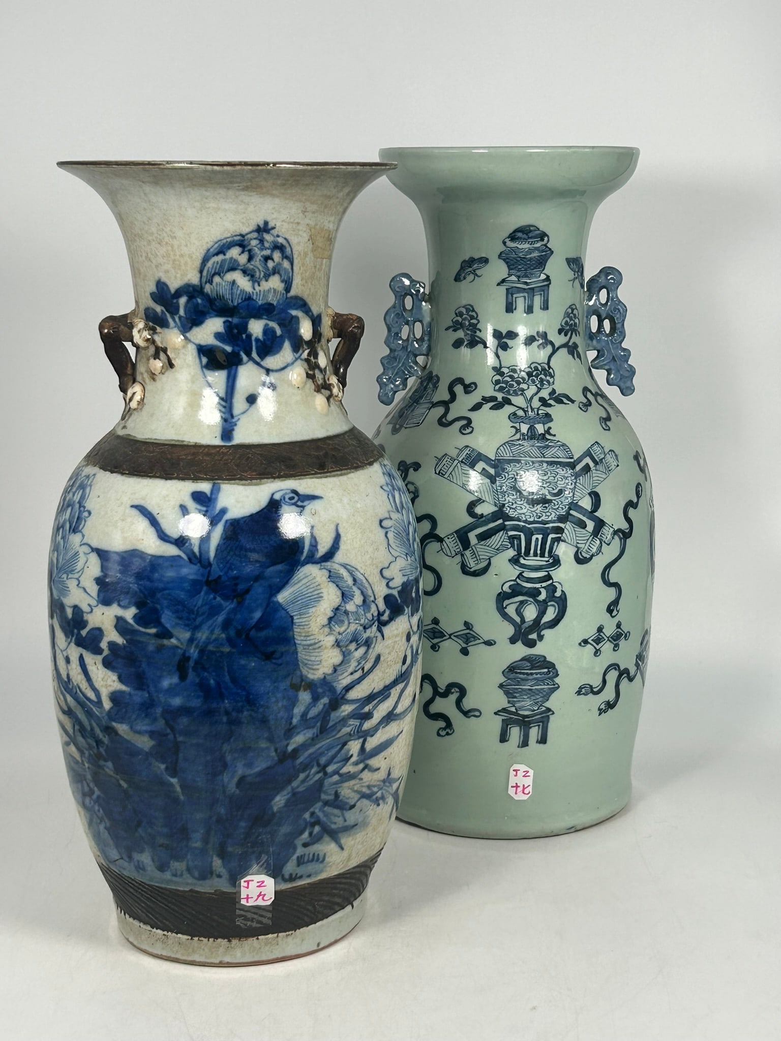 Two Chinese Blue and White Porcelain Vases: The 'antiques' vase measures 17.1/4 in. high, 7 in. wide; the 'bird and flower' measures 17 in. high, 7 in. wide.