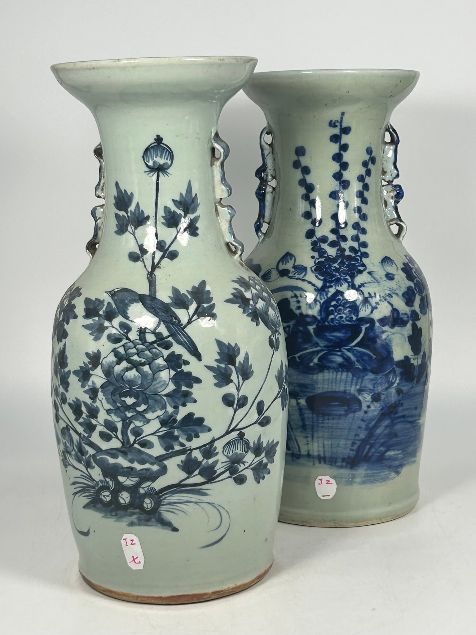 Two Chinese Blue and White Porcelain Vases: The 'bird and flower' vase measures 17 in. high, 7 in. wide; the 'lotus pond' vase measures 16.3/4 in. high, 7 in. wide.