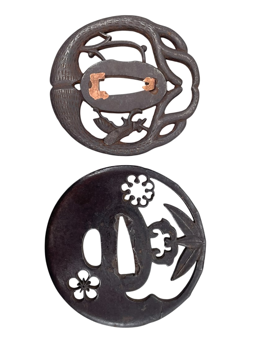 Two Japanese Samurai Sword Guard, Tsuba: The larger one measures 3 in. diam.; the smaller measures 2.3/4 in. long, 2.1/2 in. wide.