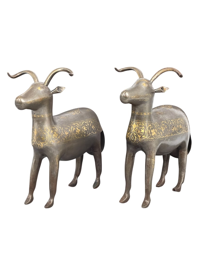 A Pair of Persian Safavid-Type Gilt-Decorated Iron Figures of Ibexes, 19th Century: 9.1/2 in. high, 9.1/2 in. wide each.