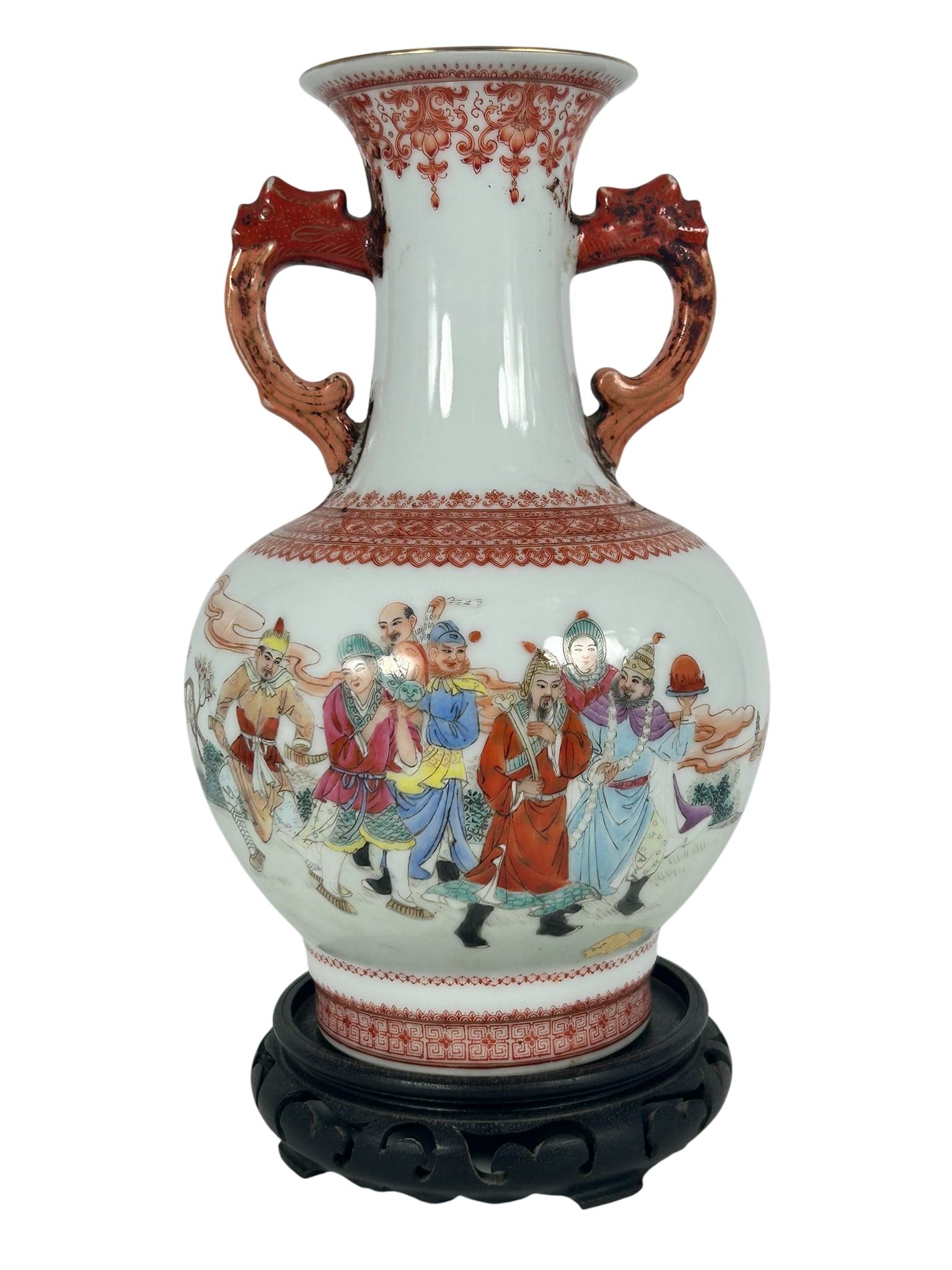 A Chinese Famille Rose Iron-Red Decorated 'Eight Immortals' Vase, 20th Century: With a wood stand. The vase measures 11.1/2 in. high, 6.3/4 in. wide.