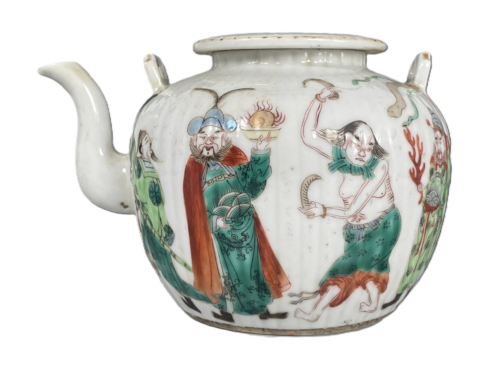 A Chinese Famille Verte 'Immortals' Porcelain Teapot and Cover, Qing Dynasty: 4 in. high, 5.3/4 in. wide.