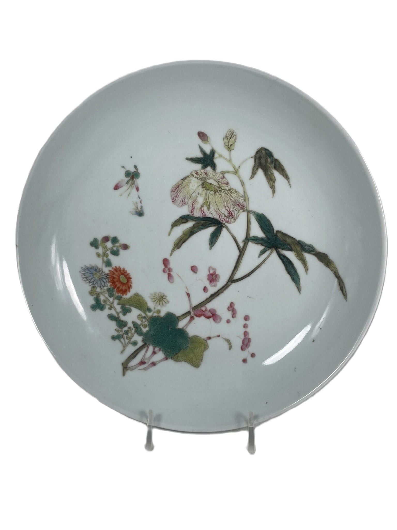 A Chinese Famille Rose 'Butterfly and Flower' Porcelain Dish, 19th Century: A Guangxu mark on the underside. 9.1/2 in. diam.