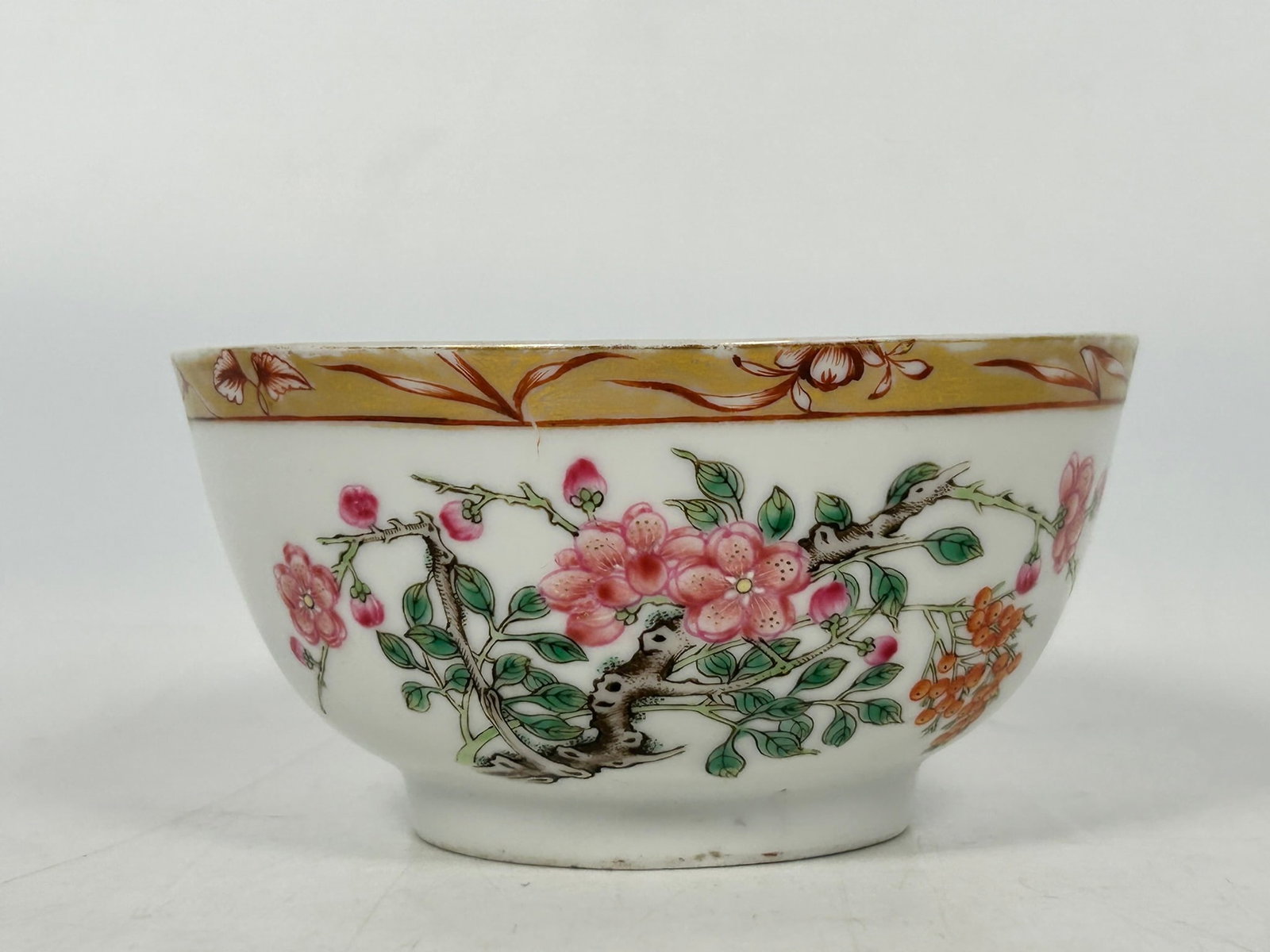 A Chinese Famille Rose Gilt-Decorated 'Flower' Porcelain Bowl: 2.1/8 in. high, 4.1/4 in. diam.