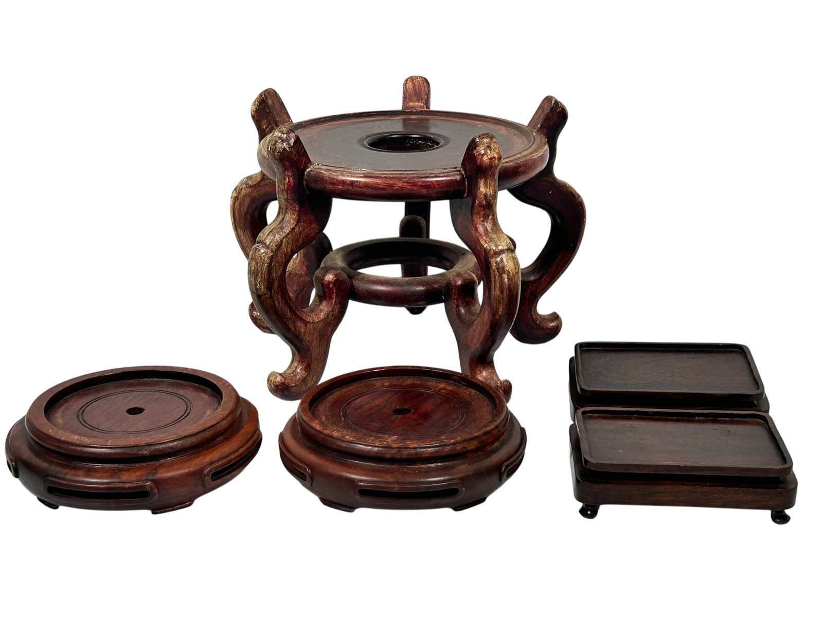 A Group of Five Chinese Wood Stands: The largest one measures 9.1/4 in. high, 13 in. wide.