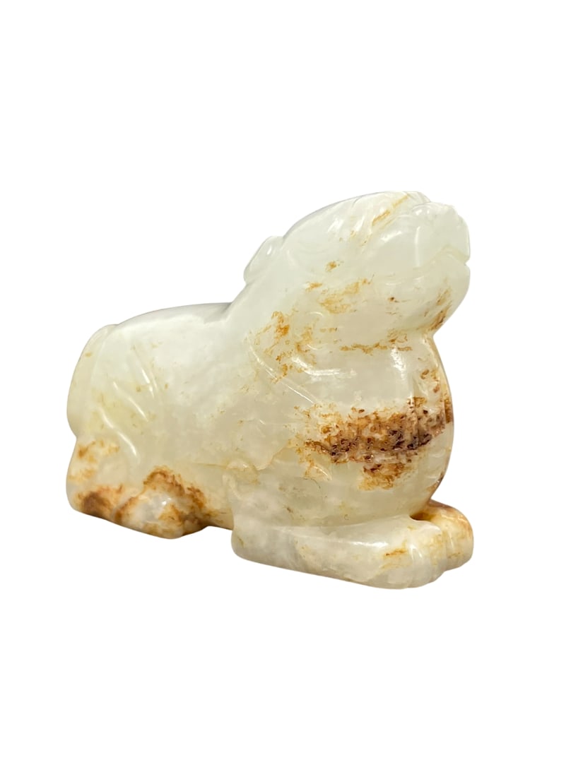 A Chinese White and Russet Carving of Mythical Animal: 1.1/4 in. high, 1.5/8 in. wide.