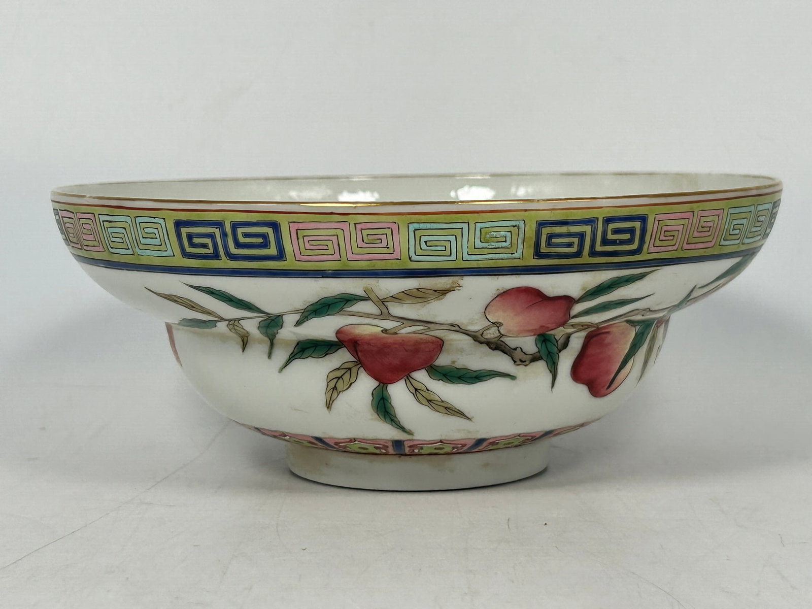 A Chinese Famille Rose 'Bats and Peaches' Porcelain Bowl, Qing Hua Zhen Pin Mark: 2.3/4 in. high, 6.3/4 in. diam.