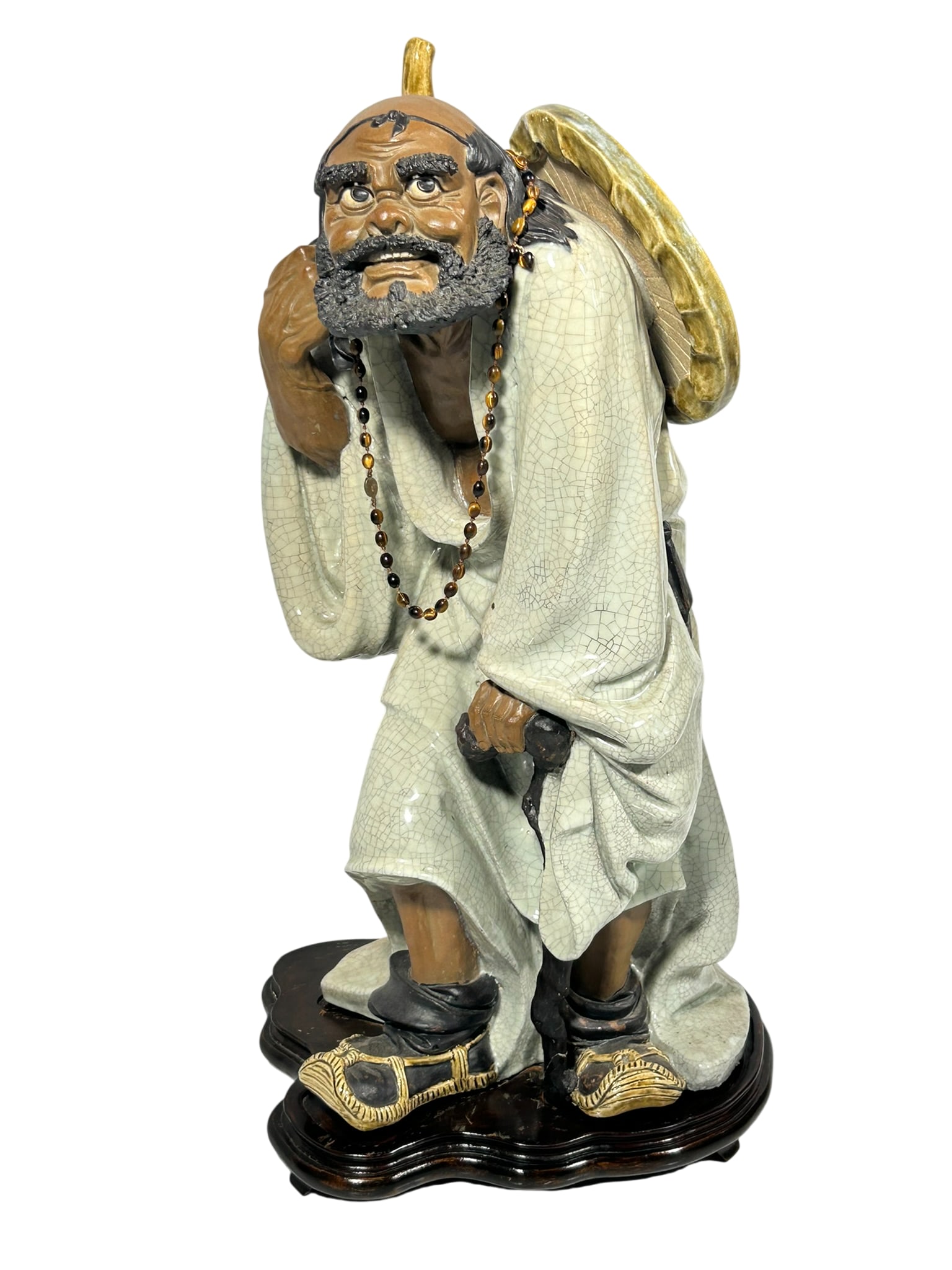 A Chinese Large Shiwan Pottery Figure of Tieguai Li: With a wood stand. 27 in. high, 15 in. wide for the figure.