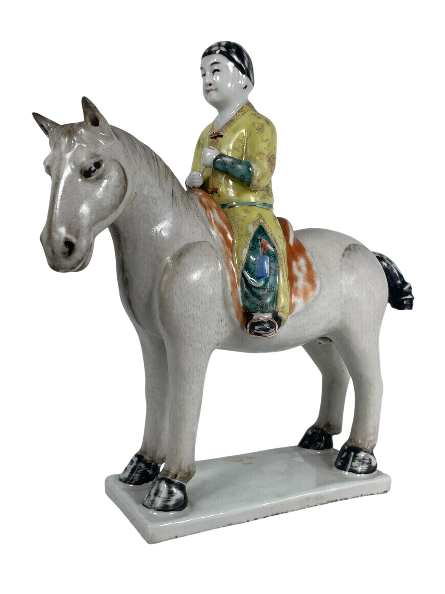 A Chinese Famille Rose Porcelain Figure of Equestrian, 18th Century: 11 in. high, 9.1/2 in. wide.