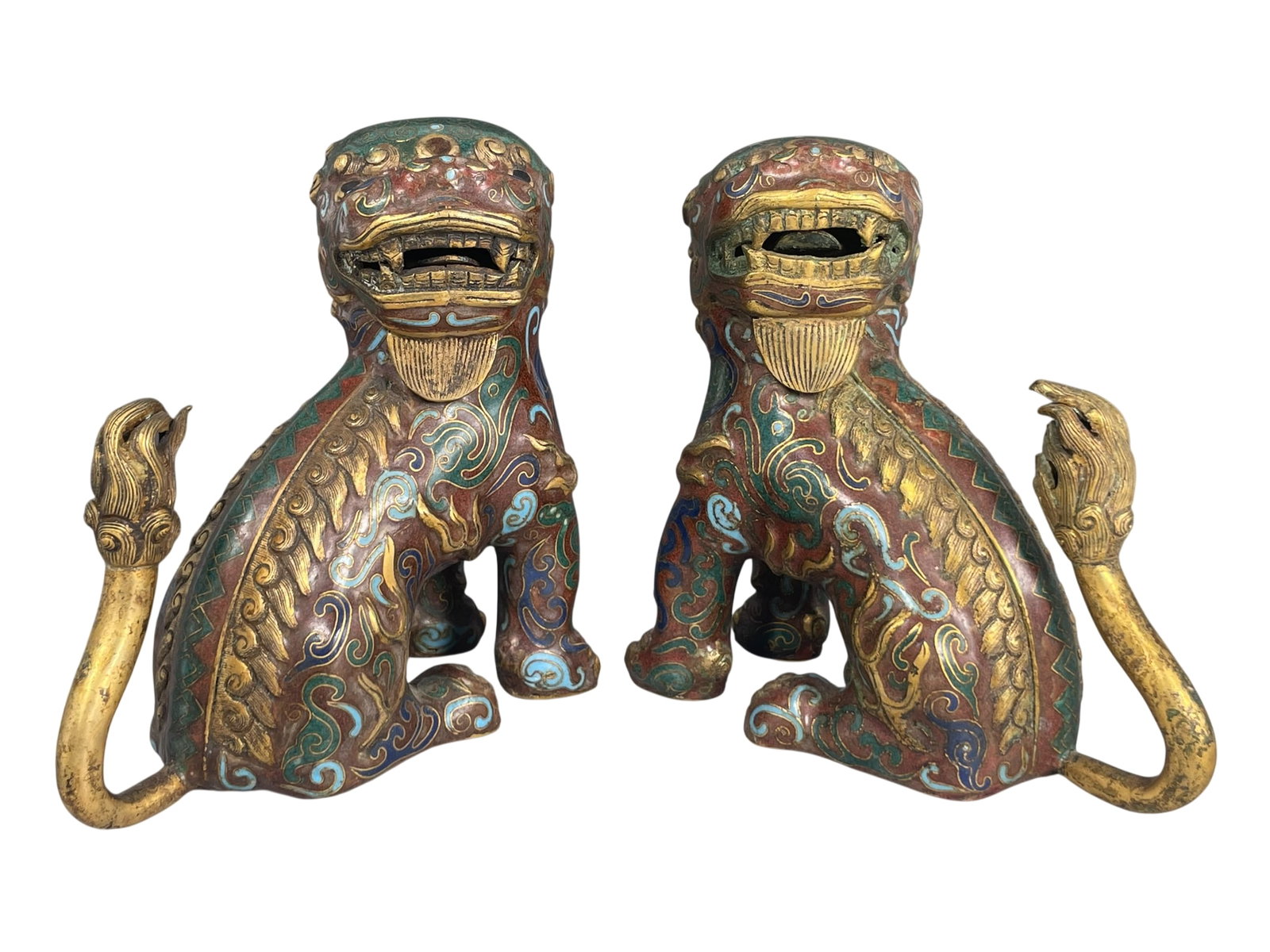 A Pair of Chinese Cloisonne Enamel Figures of Buddhist Lions: 5.1/8 in. high, 4.3/4 in. wide.