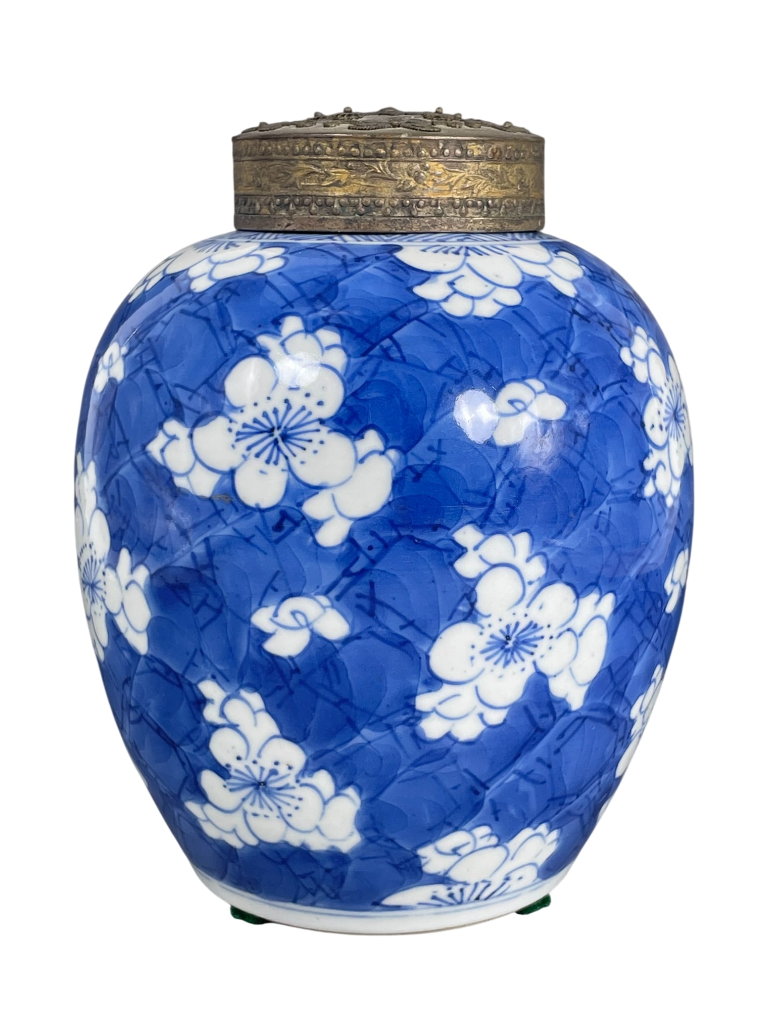 A Chinese Blue and White 'Blossoming Plum Branches' Jar and a Pewter Cover, Kangxi Period, Qing: 6.1/2 in. high, 5 in. wide overall.