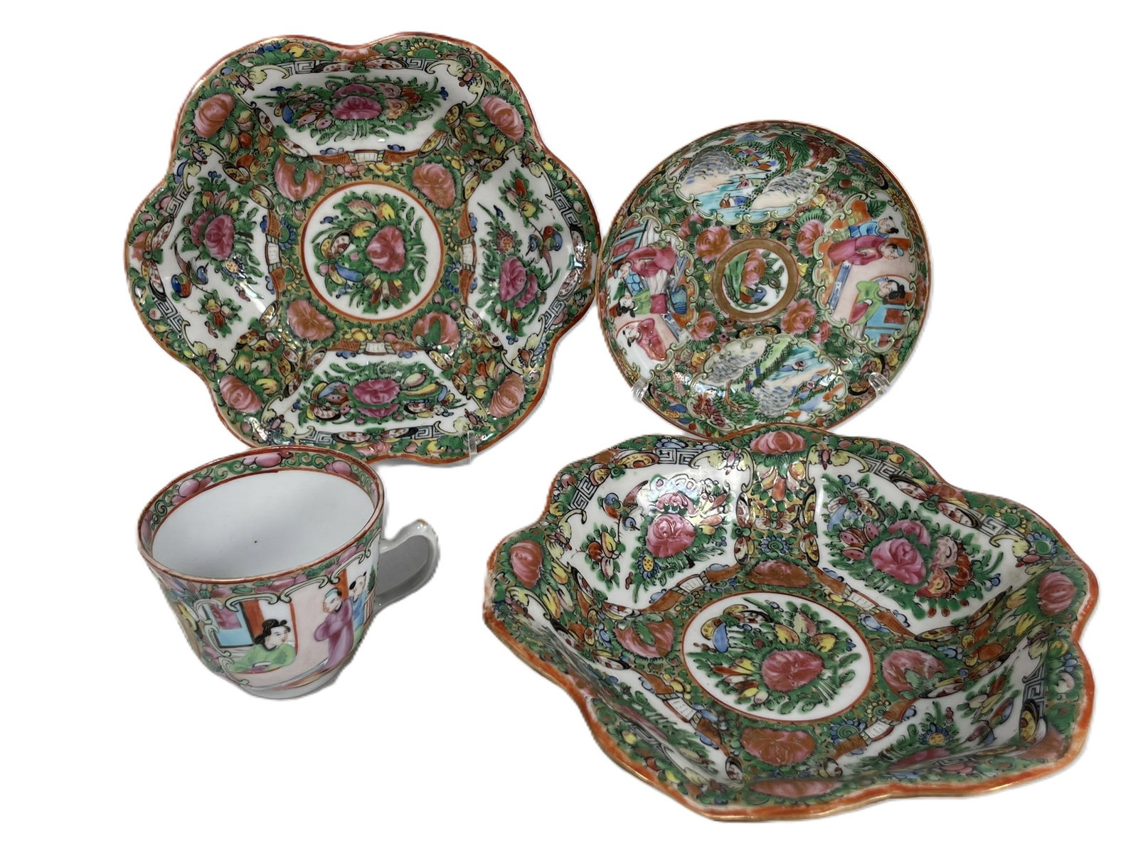 A Group of Four Chinese Famille Rose Gilt-Decorated Porcelain Ware: Comprising a pair of deep dishes, 1.7/8 in. high, 7.1/2 in. wide each; a small dish, 5.1/4 in. diam.; and a tea cup, 2.3/8 in. high, 3.5/8 in. wide.