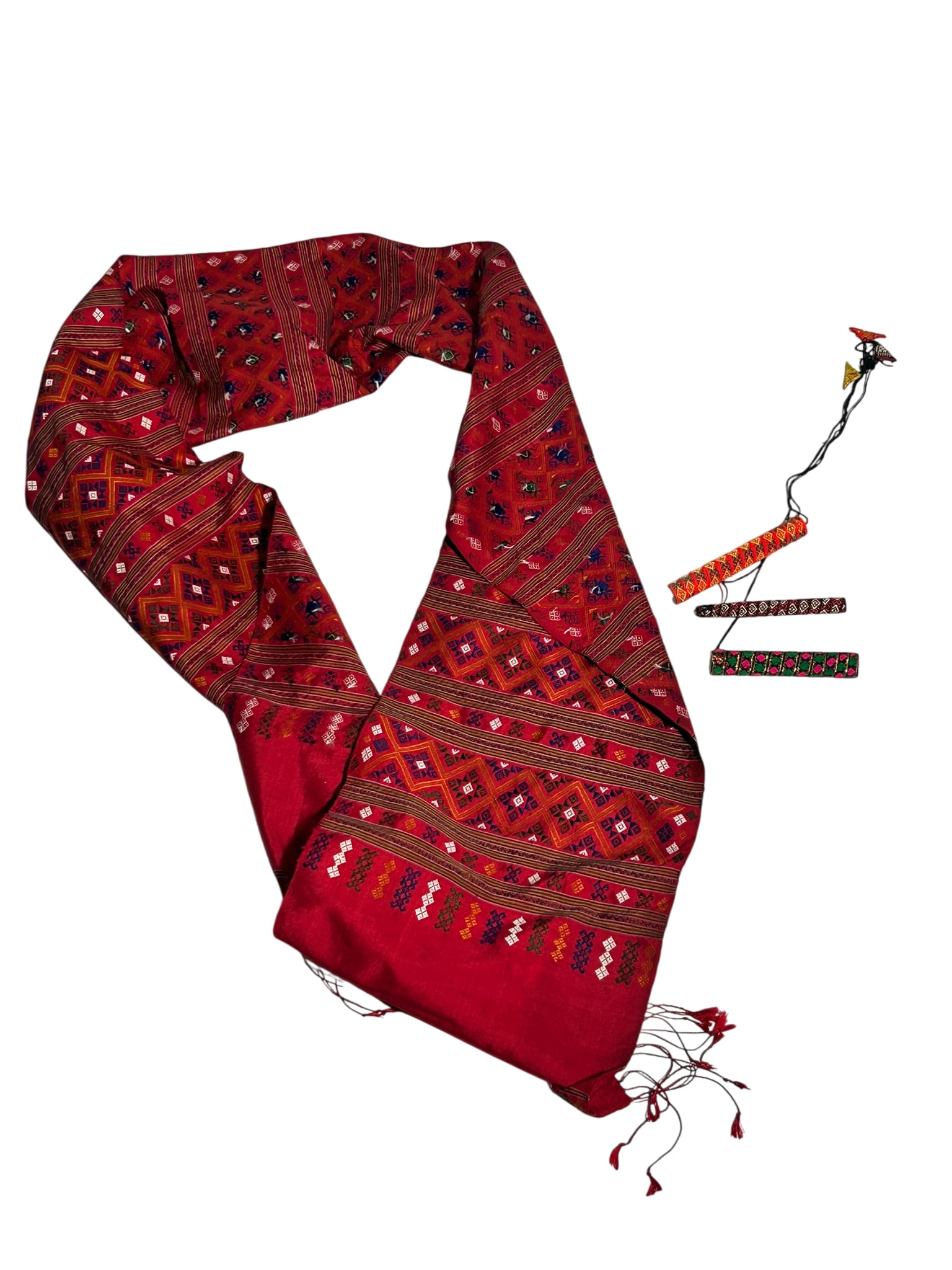 A Group of Three Mouth Harps and a Praewa Thai Silk Fabric: The longest mouth harp measures 5 in. long, 3/4 in diam.; the fabric measures 79.1/2 in. long, 10 in. wide. From antique collection of a former Yale Faculty member.